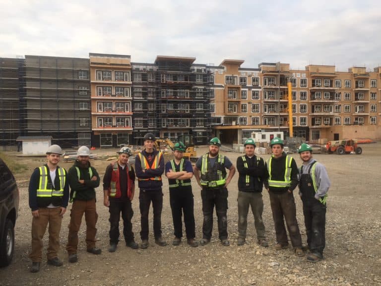 workers in front of project