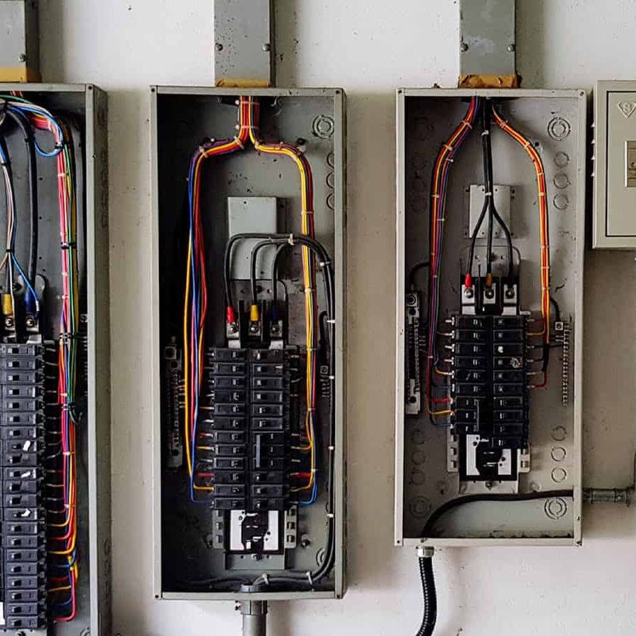 Circuit breaker panels open in garage-like setting